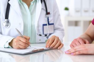 female doctor speaking with a patient