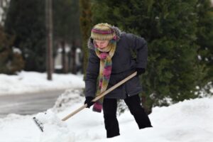 shoveling a snowy sidewalk