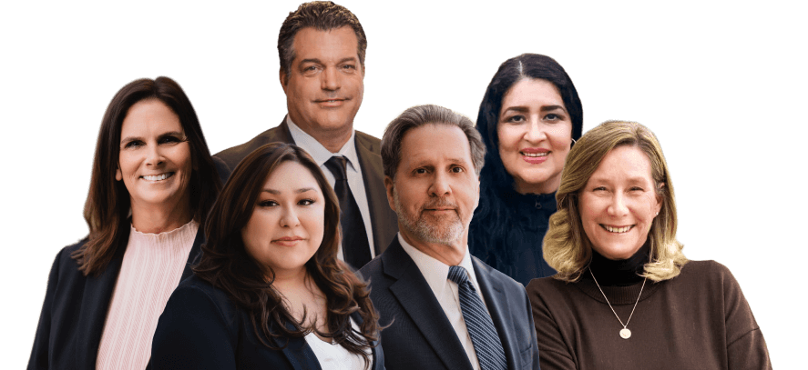 Group portrait of three women and three men dressed in business attire, standing and smiling against a plain white background.