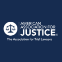 Logo of the American Association for Justice featuring a balanced scale symbol and the tagline "The Association for Trial Lawyers" on a dark blue background.